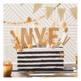 Black and white striped New Year's Eve cake with gold NYE topper